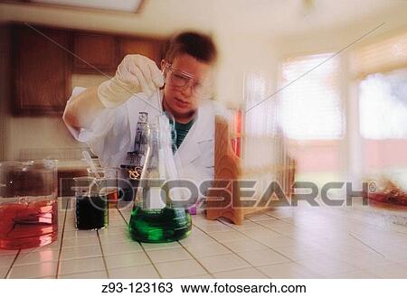 Stock Image - Young boy in science lab. Fotosearch