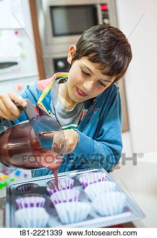 Young boy learning to cook, in the kitchen Valencia, Spain,. View Large Photo Image Stock Photo - Young boy learning to cook, in the kitchen Valencia, Spain,.. Fotosearch