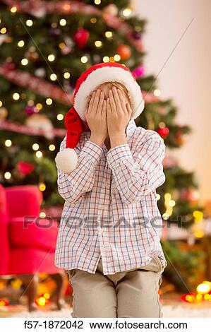Stock Image - Young boy looking forward for Christmas. Fotosearch