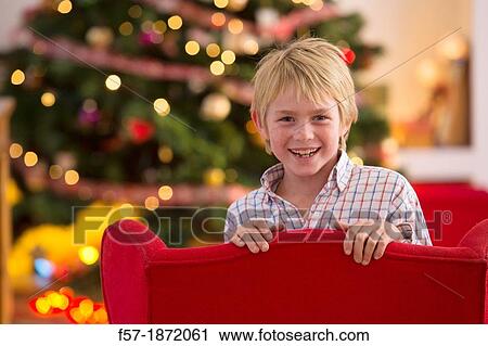 Stock Image - Young boy looking forward for Christmas. Fotosearch