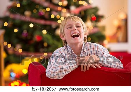 Young boy looking forward for Christmas View Large Photo Image Stock Photo - Young boy looking forward for Christmas. Fotosearch