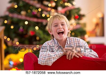 Young boy looking forward for Christmas View Large Photo Image Stock Photo - Young boy looking forward for Christmas. Fotosearch