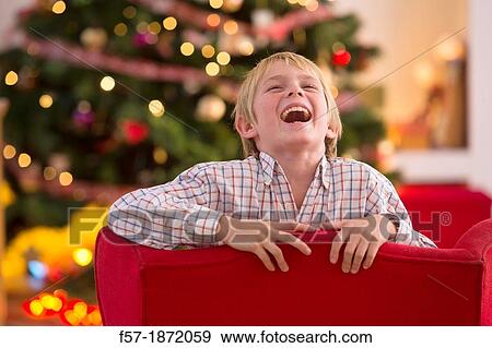 Young boy looking forward for Christmas View Large Photo Image Stock Photo - Young boy looking forward for Christmas. Fotosearch