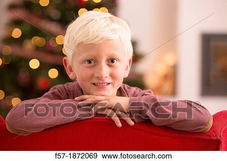 Young boy looking forward for Christmas View Large Photo Image Stock Photo - Young boy looking forward for Christmas. Fotosearch