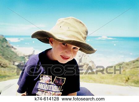 Young Boy Looking Quizzically At Camera View Large Photo Image Stock Photo - Young Boy Looking Quizzically At Camera. Fotosearch