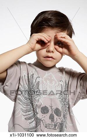 Young Boy making binoculars with hands View Large Photo Image Stock Image - Young Boy making binoculars with hands. Fotosearch