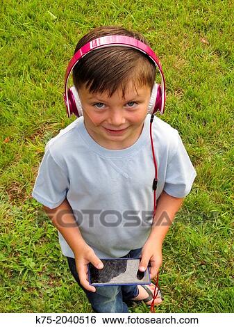 Young boy playing game on computer View Large Photo Image Stock Photograph - Young boy playing game on computer. Fotosearch