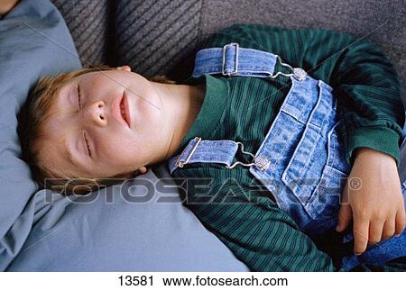 Stock Image - Young boy sleeping. Fotosearch