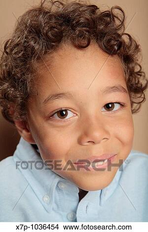 Picture - Young boy smiling. Fotosearch
