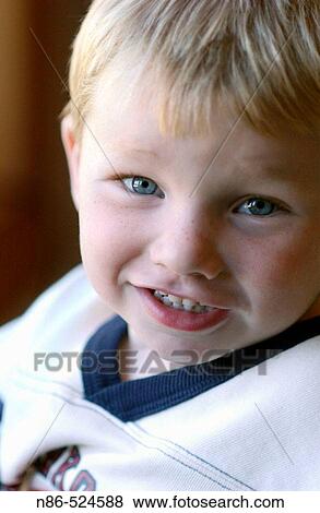 Young boy smiling View Large Photo Image Stock Photo - Young boy smiling. Fotosearch