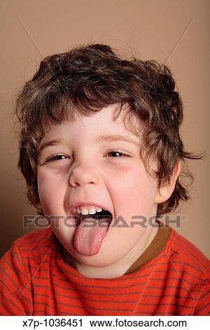 Young boy sticking out tongue View Large Photo Image Stock Image - Young boy sticking out tongue. Fotosearch