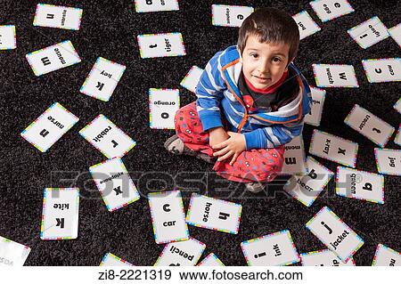 Young boy surrounded by alphabet cards. View Large Photo Image Stock Photo - Young boy surrounded by alphabet cards.. Fotosearch