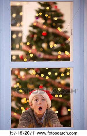 Young boy waiting for santa claus View Large Photo Image Stock Image - Young boy waiting for santa claus. Fotosearch