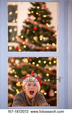 Young boy waiting for santa claus View Large Photo Image Stock Image - Young boy waiting for santa claus. Fotosearch