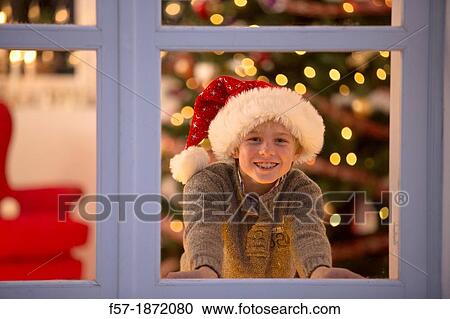 Stock Image - Young boy waiting for santa claus. Fotosearch