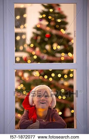 Young boy waiting for santa claus View Large Photo Image Stock Photo - Young boy waiting for santa claus. Fotosearch
