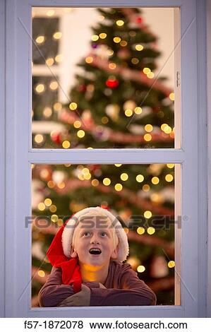 Young boy waiting for santa claus View Large Photo Image Stock Photo - Young boy waiting for santa claus. Fotosearch