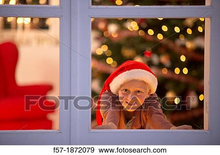 Young boy waiting for santa claus View Large Photo Image Stock Photo - Young boy waiting for santa claus. Fotosearch