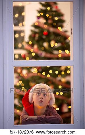 Young boy waiting for santa claus View Large Photo Image Stock Photograph - Young boy waiting for santa claus. Fotosearch