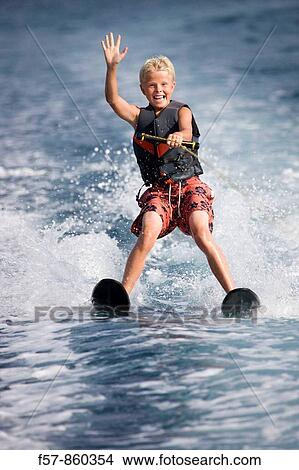Young boy water skiing in the Mediterranean View Large Photo Image Picture - Young boy water skiing in the Mediterranean. Fotosearch