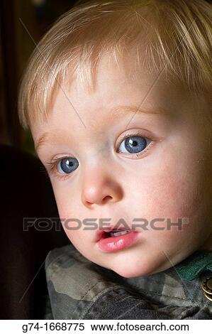 Young boy with big blue eyes View Large Photo Image Stock Photography - Young boy with big blue eyes. Fotosearch