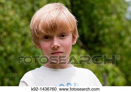 Stock Image - Young boy with blonde hair.. Fotosearch