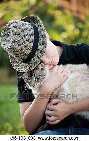 Stock Image - Young boy with cat. Fotosearch