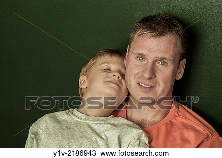 Young boy with his father. View Large Photo Image Stock Image - Young boy with his father.. Fotosearch