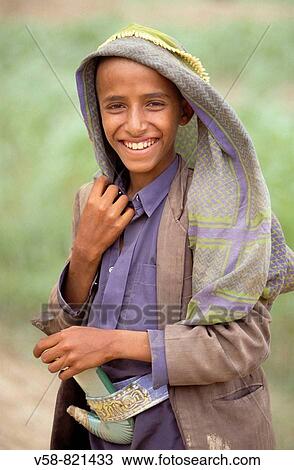 YOUNG BOY WITH JAMBIYA, WADI LISSAN, SHAHARA REGION, YEMEN View Large Photo Image Stock Image - YOUNG BOY WITH JAMBIYA, WADI LISSAN, SHAHARA REGION, YEMEN. Fotosearch