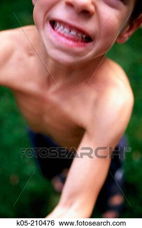 Young boy with strained look View Large Photo Image Stock Photograph - Young boy with strained look. Fotosearch