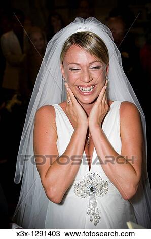 Stock Image - Young bride overcome with happiness. Fotosearch