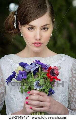 Young bride with wild flowers bouquet. View Large Photo Image Stock Image - Young bride with wild flowers bouquet.. Fotosearch