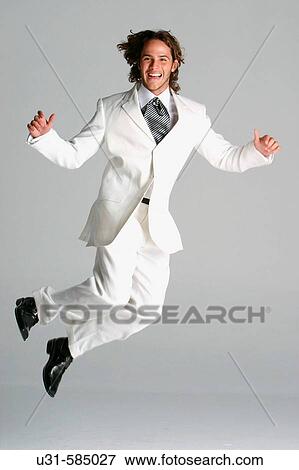 Young bridegroom jumping and smiling. View Large Photo Image Stock Photo - Young bridegroom jumping and smiling.. Fotosearch