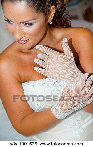 Young bridewith gloves posing View Large Photo Image Stock Photography - Young bridewith gloves posing. Fotosearch