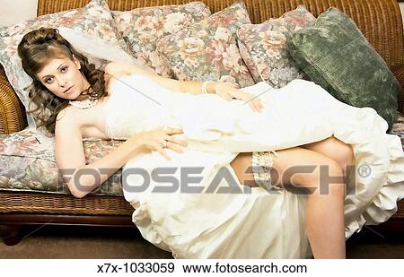 Young brunette bride after her wedding ceremony, takes a little? breather? View Large Photo Image Stock Photo - Young brunette bride after her wedding ceremony, takes a little? breather?. Fotosearch