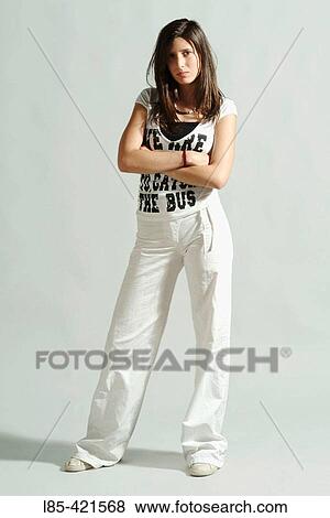 Stock Photo - Young brunette girl on white background. Fotosearch
