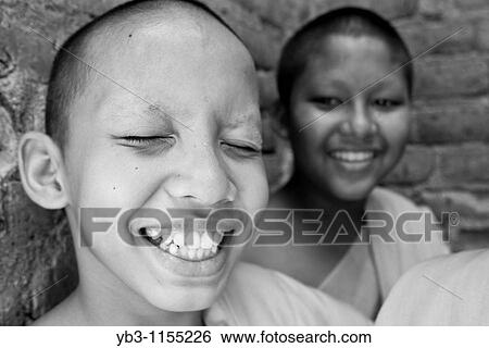 Young Buddhist Monks, Wat Si Chum, Sukhothai, Thailand View Large Photo Image Stock Photograph - Young Buddhist Monks, Wat Si Chum, Sukhothai, Thailand. Fotosearch