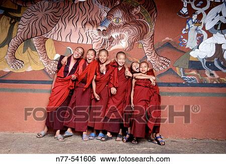 Young buddist monks under a tiger mural. Paro Dzong, Bhutan View Large Photo Image Stock Photograph - Young buddist monks under a tiger mural. Paro Dzong, Bhutan. Fotosearch