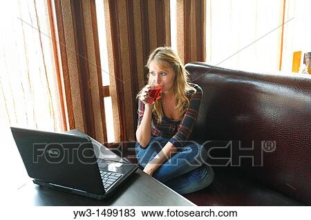 young business woman working on her laptop in a cafe View Large Photo Image Stock Image - young business woman working on her laptop in a cafe. Fotosearch