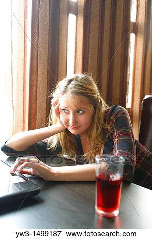 young business woman working on her laptop in a cafe View Large Photo Image Stock Photo - young business woman working on her laptop in a cafe. Fotosearch