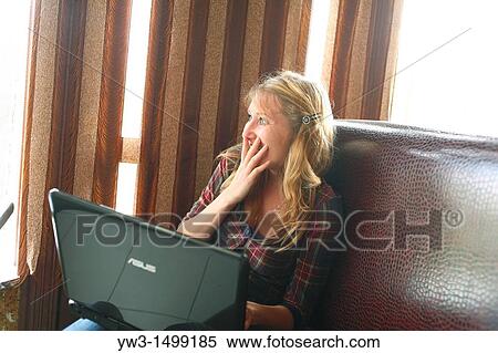 young business woman working on her laptop in a cafe View Large Photo Image Stock Photography - young business woman working on her laptop in a cafe. Fotosearch