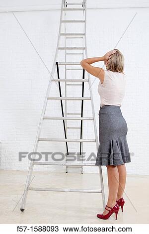 Young businesswoman contemplating her future View Large Photo Image Stock Image - Young businesswoman contemplating her future. Fotosearch
