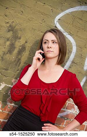 Young businesswoman of Russian descent talking on a cellular phone. View Large Photo Image Stock Image - Young businesswoman of Russian descent talking on a cellular phone.. Fotosearch