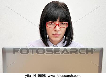 Young businesswoman using laptop View Large Photo Image Stock Photo - Young businesswoman using laptop. Fotosearch