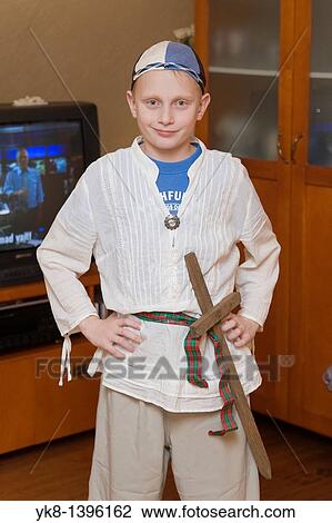 Young Caucasian Warrior Boy with Sword in Costume View Large Photo Image Stock Image - Young Caucasian Warrior Boy with Sword in Costume. Fotosearch