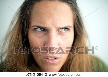 Young Caucasian woman with blond hair and green eyes with anger expression. View Large Photo Image Stock Image - Young Caucasian woman with blond hair and green eyes with anger expression.. Fotosearch