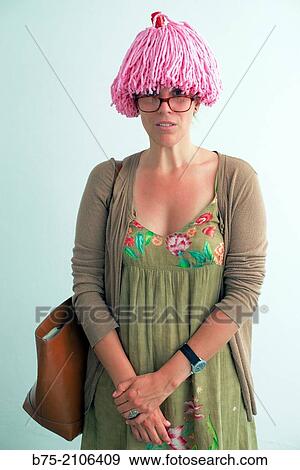 Young Caucasian woman with pink wig stand waiting. View Large Photo Image Stock Photo - Young Caucasian woman with pink wig stand waiting.. Fotosearch