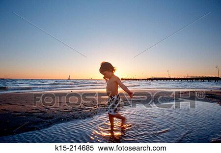 Young child on beach View Large Photo Image Stock Photography - Young child on beach. Fotosearch