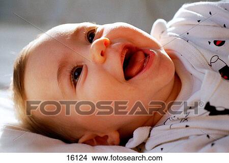Young child on bed View Large Photo Image Picture - Young child on bed. Fotosearch