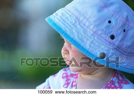 Young child wearing a hat View Large Photo Image Stock Photo - Young child wearing a hat. Fotosearch